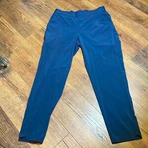 Blue track pants, crop size medium polyester and elastin waste 14 inseam 25